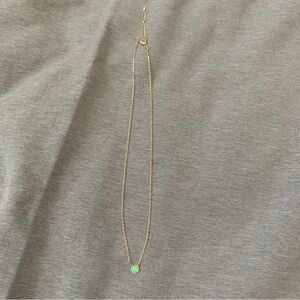 Elegant Gold Necklace with Green Pendant